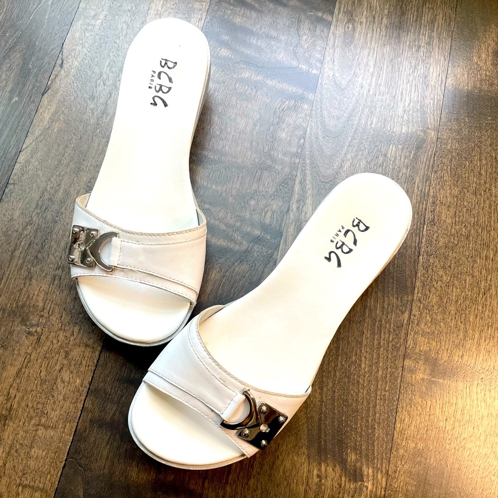 BCBG Low heel, flat sandal, white with chrome buckle size 36, size 6 gently used